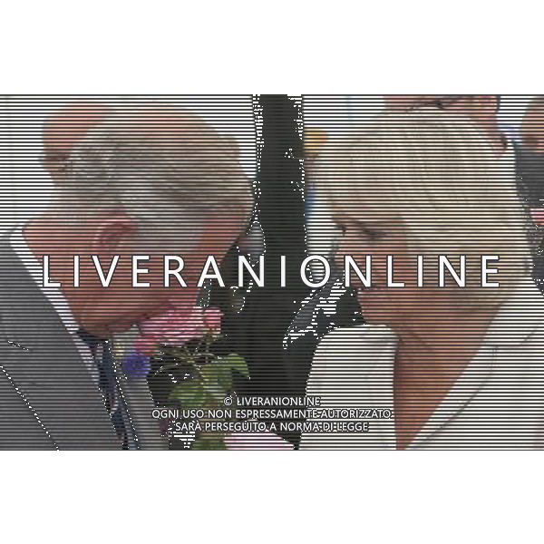KING\'S LYNN, ENGLAND - JULY 31: Prince Charles, Prince of Wales and Camilla, Duchess of Cornwall smell roses during a visit to the 132nd Sandringham Flower Show at Sandringham House on July 31, 2013 in King\'s Lynn, England. ©photoshot/AGENZIA ALDO LIVERANI SAS - ITALY ONLY - REALI INGLESI: Il principe Carlo d\'inghilterra con la moglie Camilla duchessa di Cornovaglia