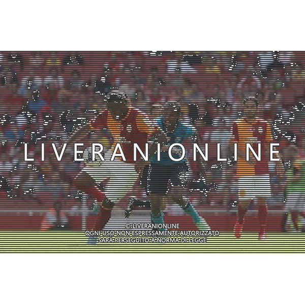 Galatasaray\'s Didier Drogba takes on FC Porto\'s Eliaquim Mangala (Photo by Kieran Galvin/CameraSport) Football - The Emirates Cup - Galatasaray v FC Porto - Saturday 3rd August 2013 - The Emirates Stadium - London Œ© CameraSport - 43 Linden Ave. Countesthorpe. Leicester. England. LE8 5PG - Tel: +44 (0) 116 277 4147 - admin@camerasport.com - www.camerasport.com AG ALDO LIVERANI SAS ONLY ITALY