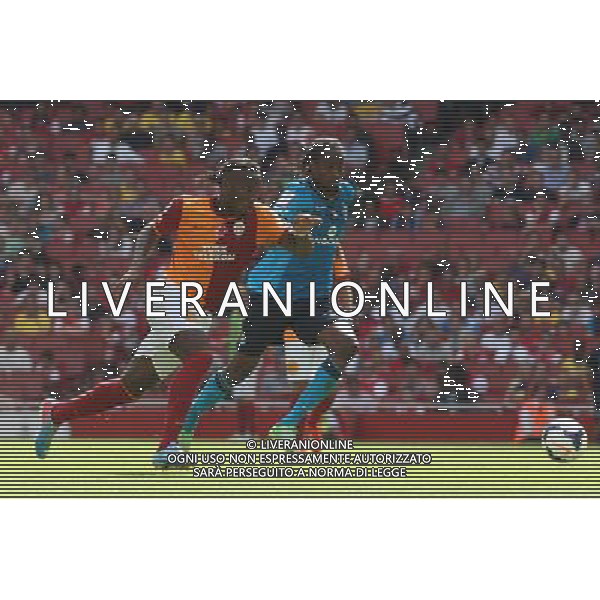 Galatasaray\'s Didier Drogba takes on FC Porto\'s Eliaquim Mangala (Photo by Kieran Galvin/CameraSport) Football - The Emirates Cup - Galatasaray v FC Porto - Saturday 3rd August 2013 - The Emirates Stadium - London Œ© CameraSport - 43 Linden Ave. Countesthorpe. Leicester. England. LE8 5PG - Tel: +44 (0) 116 277 4147 - admin@camerasport.com - www.camerasport.com AG ALDO LIVERANI SAS ONLY ITALY