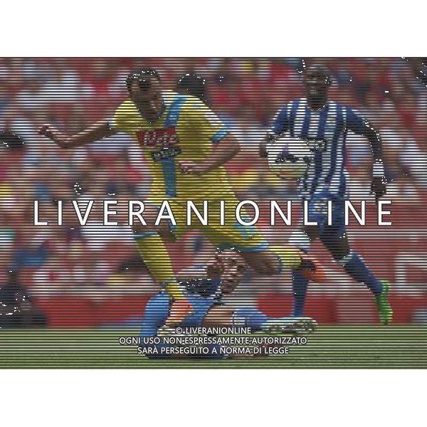 FC Porto\'s Nicolas Otamendi tackles Napoli\'s Goran Pandev (Photo by Kieran Galvin/CameraSport) Football - The Emirates Cup - Napoli v FC Porto - Sunday 4th August 2013 - The Emirates Stadium - London Œ© CameraSport - 43 Linden Ave. Countesthorpe. Leicester. England. LE8 5PG - Tel: +44 (0) 116 277 4147 - admin@camerasport.com - www.camerasport.com AG ALDO LIVERANI SAS ONLY ITALY