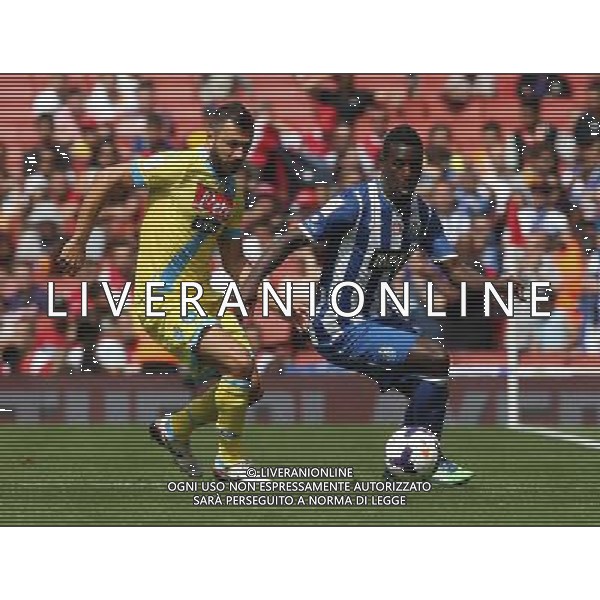 FC Porto\'s Silvestre Varela holds of Napoli\'s Andrea Dossena (Photo by Kieran Galvin/CameraSport) Football - The Emirates Cup - Napoli v FC Porto - Sunday 4th August 2013 - The Emirates Stadium - London Œ© CameraSport - 43 Linden Ave. Countesthorpe. Leicester. England. LE8 5PG - Tel: +44 (0) 116 277 4147 - admin@camerasport.com - www.camerasport.com AG ALDO LIVERANI SAS ONLY ITALY
