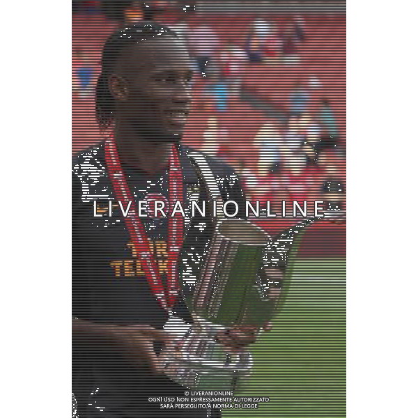 Galatasaray\'s Didier Drogua with Trophy (Photo by Kieran Galvin/CameraSport) Football - The Emirates Cup - Arsenal v Galatasaray - Sunday 4th August 2013 - The Emirates Stadium - London Œ© CameraSport - 43 Linden Ave. Countesthorpe. Leicester. England. LE8 5PG - Tel: +44 (0) 116 277 4147 - admin@camerasport.com - www.camerasport.com AG ALDO LIVERANI SAS ONLY ITALY