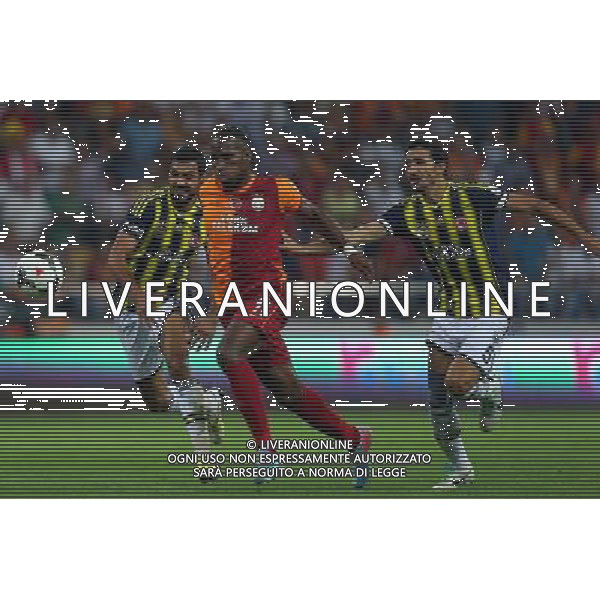 Turkish supercup match between Fenerbahce and Galatasaray at Kadir Has Stadium in Kayseri on August 11, 2013. Match Scored: Fenerbahce 0 - Galatasaray 1 Pictured: Didier Drogba of Galatasaray and Mehmet Topal of Fenerbahce. TURCJA SUPER PUCHAR LIGA TURECKA PILKA NOZNA SEZON 2013/2014 FOT.SESKIM PHOTO/NEWSPIX.PL TURKEY, GERMANY, AUSTRIA AND UK OUT !!! --- Newspix.pl AG ALDO LIVERANI SAS ONLY ITALY *** Local Caption *** www.newspix.pl mail us: info@newspix.pl call us: 0048 022 23 22 222 --- Polish Picture Agency by Ringier Axel Springer Poland