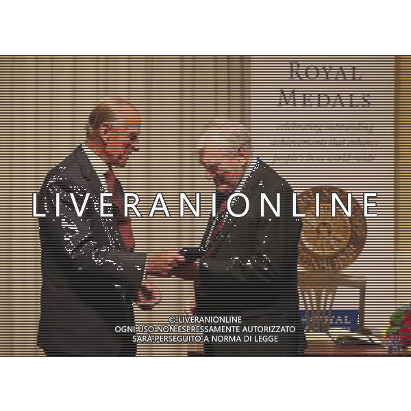 The Duke of Edinburgh presents Sir John Cadogan with a Royal Medal during a presentation at the Royal Society of Edinburgh as he carried out his first official engagement in nearly two months. The Royal Medals are awarded in a range of categories, these are Life Sciences, Physical and Engineering Sciences, Humanities and Social Sciences, Business and Commerce. ©photoshot/AGENZIA ALDO LIVERANI SAS - ITALY ONLY - REALI INGLESI: Filippo Duca di Edimburgo alla consegna delle Medaglie Reali nel suo primo impegno ufficiale in quasi due mesi.