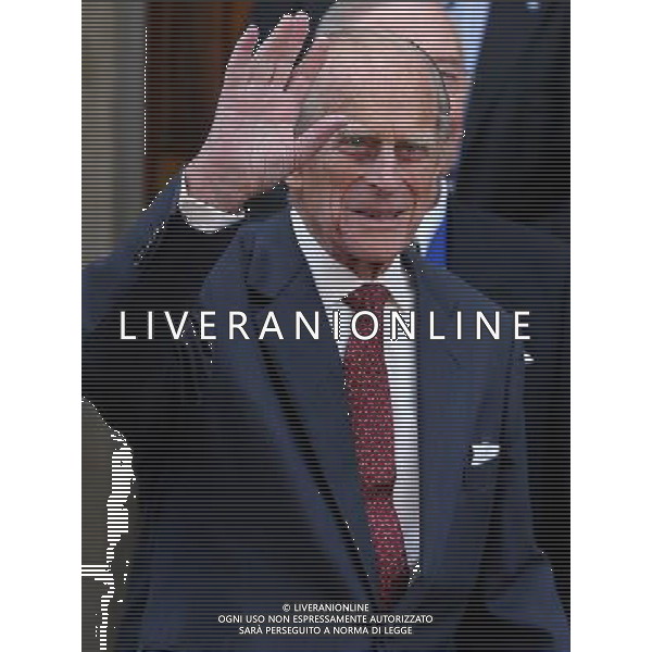 The Duke of Edinburgh waves as he leaves presenting Royal Medals at the Royal Society of Edinburgh as he carried out his first official engagement in nearly two months. The Royal Medals are awarded in a range of categories, these are Life Sciences, Physical and Engineering Sciences, Humanities and Social Sciences, Business and Commerce. ©photoshot/AGENZIA ALDO LIVERANI SAS - ITALY ONLY - REALI INGLESI: Filippo Duca di Edimburgo alla consegna delle Medaglie Reali nel suo primo impegno ufficiale in quasi due mesi.