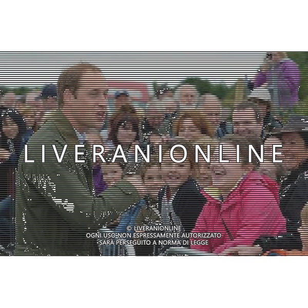 Britain\'s Prince William (L) speaks to members of the public as he visits the Anglesey Show in North Wales on August 14, 2013. The Anglesey Show is the largest two day agricultural event in North Wales. ©photoshot/AGENZIA ALDO LIVERANI SAS - ITALY ONLY - REALI INGLESI: Il principe William d\'inghilterra alla sua prima uscita ufficiale dopo la nascita del figlio, in visita presso la Mostra Anglesey nel Galles del Nord il 14 agosto 2013