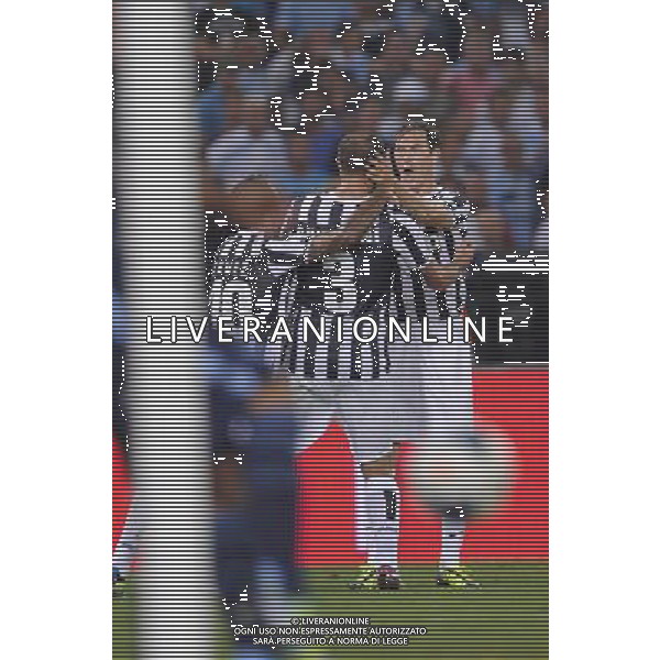 Roma - 18/08/2013 - Stadio Olimpico - Supercoppa TIM 2013-2014 - Juventus vs SS Lazio - nella foto: chiellini e lichtsteiner esultano dopo il 2 a 0 /Ph. Fabrizio Corradetti - Ag. Aldo Liverani sas
