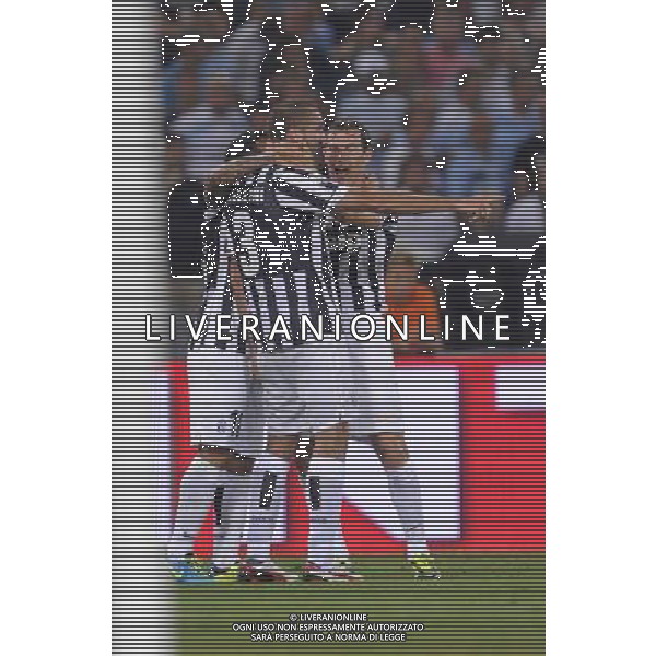Roma - 18/08/2013 - Stadio Olimpico - Supercoppa TIM 2013-2014 - Juventus vs SS Lazio - nella foto: chiellini e lichtsteiner esultano dopo il 2 a 0 /Ph. Fabrizio Corradetti - Ag. Aldo Liverani sas