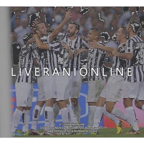 Roma - 18/08/2013 - Stadio Olimpico - Supercoppa TIM 2013-2014 - Juventus vs SS Lazio - nella foto: Giorgio Chiellini esulta con i compagni dopo il gol del 2 a 0 /Ph. Fabrizio Corradetti - Ag. Aldo Liverani sas