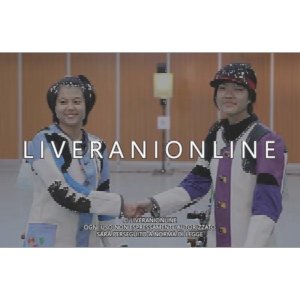 (130818) -- NANJING , Aug. 18, 2013 () -- China\'s He Zichao (L) shakes hands with South Korea\'s Kim Jehee after the women\'s 10m air rifle final of shooting event at 2013 Asian Youth Games in Nanjing, capital of east China\'s Jiangsu Province, on Aug. 18, 2013. He Zichao won the gold with 205.3 rings, Kim Jehee won the silver with 203.9 rings.(/Cao Can) ©PHOTOSHOT/AGENZIA ALDO LIVERANI SAS - ITALY ONLY - Giochi della Gioventu\' 2013 asiatici a Nanjing capitale della Cina orientale nella provincia del Jiangsu, agosto 2013.