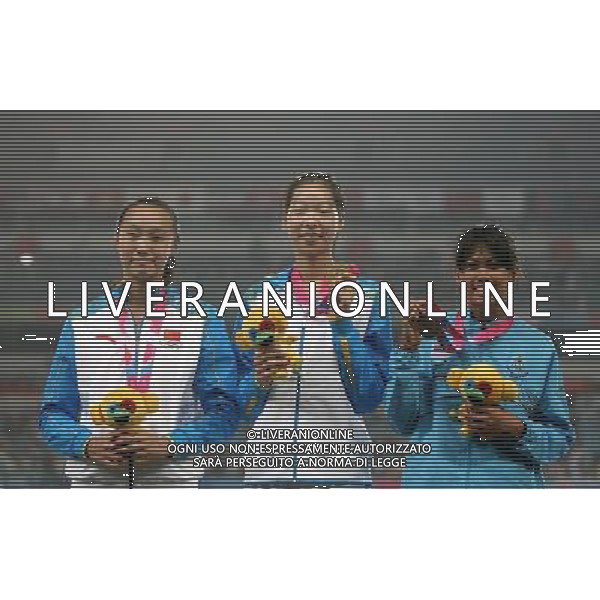 (130819)--NANJING, Aug. 19 -- Silver medalist China\'s Chai Yanbo£ågold medalist China\'s Guan Luwei and bronze medalist Thailand\'s Taemsri Krobkaew (From L to R) attend the awarding ceremony of Girls\' High Jump at 2013 Asian Youth Games in Nanjing, capital city of east China\'s Jiangsu Province, on Aug. 19, 2013. China\'s Guan Luwei won gold medal.China\'s Chai Yanbo won silver medal. Thailand\'s Taemsri Krobkaewthe third.(/Cao Can) ©photoshot/AGENZIA ALDO LIVERANI SAS - ITALY ONLY - Giochi della Gioventu\' 2013 asiatici a Nanjing capitale della Cina orientale nella provincia del Jiangsu, agosto 2013.