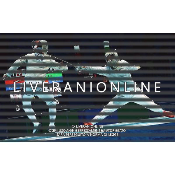 (130819)--NANJING, Aug. 19 -- China\'s Xu Qiancheng competes with South Korea\'s Bag Doyoung during the Men\'s Sabre Individual Final of Fencing at 2013 Asian Youth Games in Nanjing, capital city of east China\'s Jiangsu Province, on Aug. 19, 2013. Xu Qiancheng won the gold medal 15-12. (/Li Ziheng) ©photoshot/AGENZIA ALDO LIVERANI SAS - ITALY ONLY - Giochi della Gioventu\' 2013 asiatici a Nanjing capitale della Cina orientale nella provincia del Jiangsu, agosto 2013.
