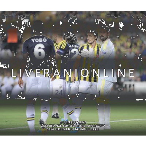 UEFA Chanpions League playoff first leg match between Fenerbahce and Arsenal at Sukru Saracoglu Stadiym in Istanbul, Turkey on august 21, 2013. Pictured: Joseph Yobo, Goalkeeper Volkan Demirel and Mehmet Topal of Fenerbahce. LIGA MISTRZOW SEZON 2013/2014 PILKA NOZNA FENERBAHCE ISTAMBUL vs ARSENAL LONDYN FOT.SESKIMPHOTO/NEWSPIX.PL POLAND, TURKEY, GERMANY, AUSTRIA AND UK OUT !!! --- Newspix.pl AG ALDO LIVERANI SAS ONLY ITALY *** Local Caption *** www.newspix.pl mail us: info@newspix.pl call us: 0048 022 23 22 222 --- Polish Picture Agency by Ringier Axel Springer Poland