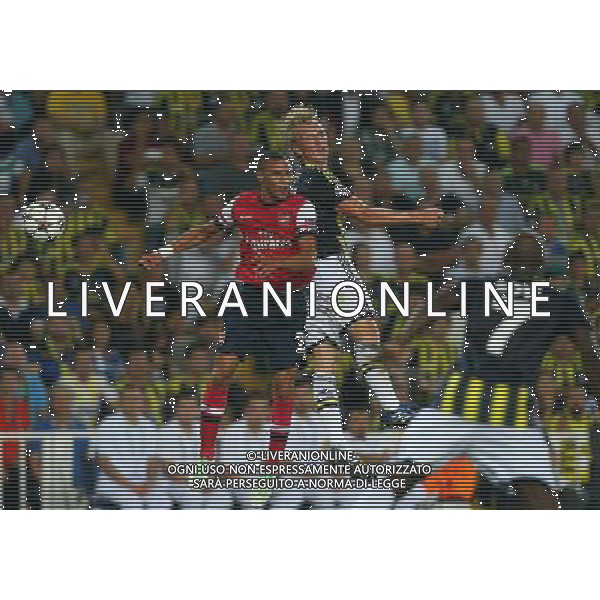 UEFA Chanpions League playoff first leg match between Fenerbahce and Arsenal at Sukru Saracoglu Stadiym in Istanbul, Turkey on august 21, 2013. Pictured: Kieran Gibbs of Arsenal and Dirk Kuyt of Fenerbahce. LIGA MISTRZOW SEZON 2013/2014 PILKA NOZNA FENERBAHCE ISTAMBUL vs ARSENAL LONDYN FOT.SESKIMPHOTO/NEWSPIX.PL POLAND, TURKEY, GERMANY, AUSTRIA AND UK OUT !!! --- Newspix.pl AG ALDO LIVERANI SAS ONLY ITALY *** Local Caption *** www.newspix.pl mail us: info@newspix.pl call us: 0048 022 23 22 222 --- Polish Picture Agency by Ringier Axel Springer Poland