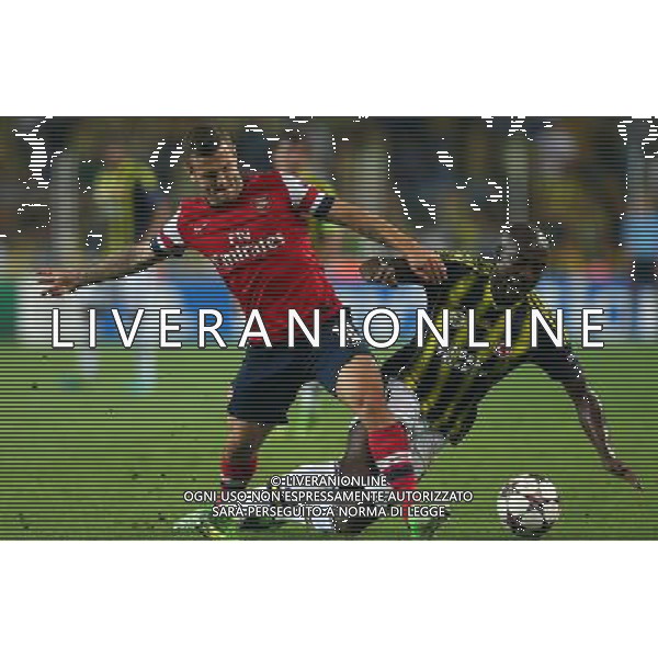 UEFA Chanpions League playoff first leg match between Fenerbahce and Arsenal at Sukru Saracoglu Stadiym in Istanbul, Turkey on august 21, 2013. Pictured: Jack Wilshere of Arsenal and Pierre Webo of Fenerbahce. LIGA MISTRZOW SEZON 2013/2014 PILKA NOZNA FENERBAHCE ISTAMBUL vs ARSENAL LONDYN FOT.SESKIMPHOTO/NEWSPIX.PL POLAND, TURKEY, GERMANY, AUSTRIA AND UK OUT !!! --- Newspix.pl AG ALDO LIVERANI SAS ONLY ITALY *** Local Caption *** www.newspix.pl mail us: info@newspix.pl call us: 0048 022 23 22 222 --- Polish Picture Agency by Ringier Axel Springer Poland