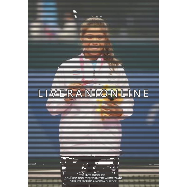 (130823)--NANJING, Aug. 23 -- One of the two Bronze medalists Thailand\'s Buayam Kamonwan attends the awarding ceremony of Women\'s Singles Final of Tennis event at 2013 Asian Youth Games in Nanjing, capital city of east China\'s Jiangsu Province, on Aug. 23, 2013. China\'s Sun Ziyue won the gold medal, Thailand\'s Buayam Kamonwan and Kazakhstan\'s Dair Assiya got the bronze medal together. (/Zhou Mi) ©photoshot/AGENZIA ALDO LIVERANI SAS - ITALY ONLY - Giochi della Gioventu\' 2013 asiatici a Nanjing capitale della Cina orientale nella provincia del Jiangsu, agosto 2013.