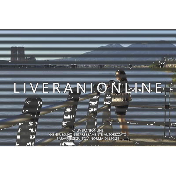 (130827) -- TAIPEI, Aug. 27, 2013 () -- A woman visits the Dadaocheng Wharf in Taipei, southeast China\'s Taiwan, Aug. 27, 2013. Dadaocheng was an important trading port in the 19th century, and is now a tourist attraction and shopping area. (/Lu Peng) (mp) ©photoshot/AGENZIA ALDO LIVERANI SAS - ITALY ONLY - Vedute panoramih“che della citta\' e del molo di Dadaocheng, con un importante porto commerciale nel 19mo secolo, e\' ora un\'attrazione turistica a Taipei, sud-est della Cina, Taiwan, 27 agosto 2013.