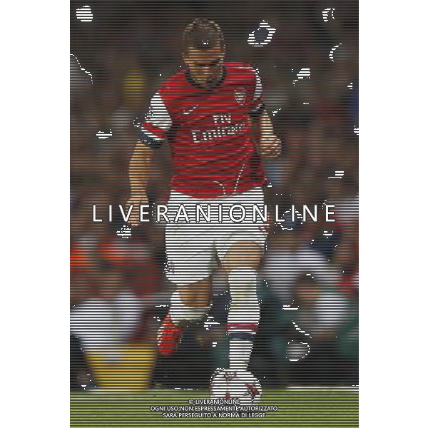 (130828) -- LONDON, Aug. 28, 2013 () -- Lukas Podolski of Arsenal breaks through during the UEFA Champions League Play-off Round Second leg match between Arsenal FC and Fenerbahce SK at Emirates Stadium in London, Britain on Aug. 27, 2013. Arsenal won 2-0 in this match. Arsenal defeated Fenerbahce with a 5-0 in aggregate to reach the Champions League for the 16th consecutive year.(/Wang Lili)