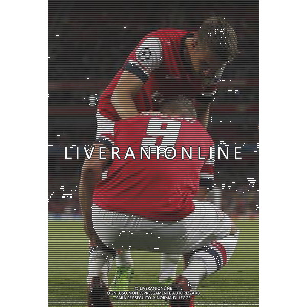 (130828) -- LONDON, Aug. 28, 2013 () -- Lukas Podolski of Arsenal is injured during the UEFA Champions League Play-off Round Second leg match between Arsenal FC and Fenerbahce SK at Emirates Stadium in London, Britain on Aug. 27, 2013. Arsenal won 2-0 in this match. Arsenal defeated Fenerbahce with a 5-0 in aggregate to reach the Champions League for the 16th consecutive year.(/Wang Lili)