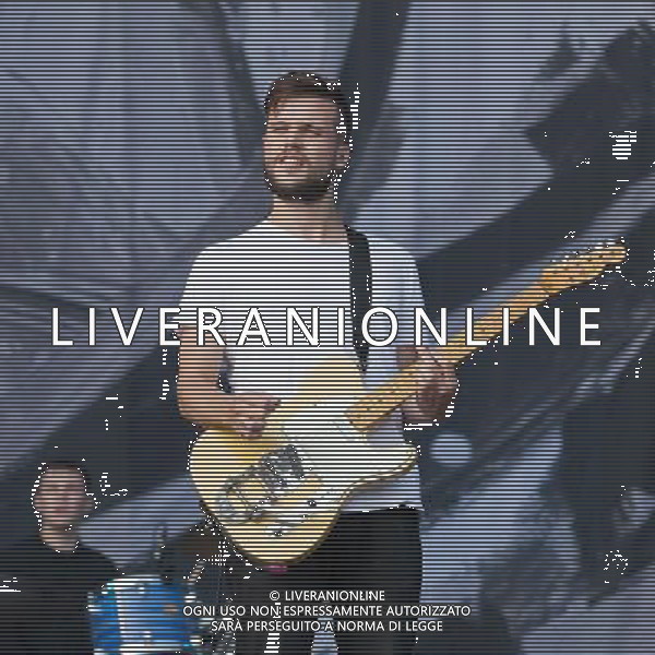 White Lies perform on the Main Stage at Leeds Festival, Bramham Park, Leeds, UK on 25th August 2013. Shown here Harry McVeigh (lead vocals and guitar) ©PHOTOSHOT/AGENZIA ALDO LIVERANI SAS - ITALY ONLY - EDITORIAL USE ONLY