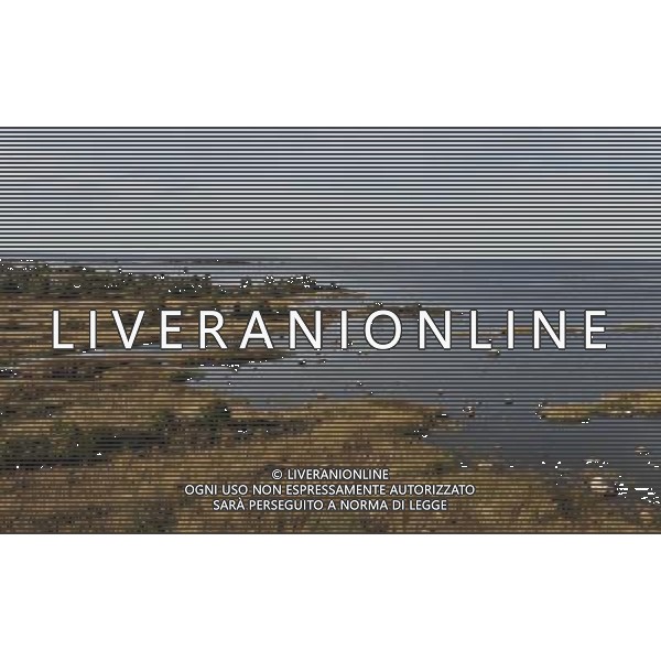 (130910) -- BRUSSELS, Sept 10, 2013 () -- Photo taken on Sept 4, 2013 shows the view of Kvarken Archipelago at Svedjehamn, about 40 kilometers north of Vaasa, Finland. The 5,600 islands of Kvarken Archipelago, which is the only admitted UNESCO World Natural Heritage of Finnish, feature unusual ridged washboard moraines, ¡®De Geer moraines¡¯, formed by the melting of the continental ice sheet, 10,000 to 24,000 years ago. The Archipelago is continuously rising from the sea in a process of rapid glacio-isostatic uplift, whereby the land, previously weighed down under the weight of a glacier, lifts at rates that are among the highest in the world. (/Ye Pingfan) ©photoshot/AGENZIA ALDO LIVERANI SAS - ITALY ONLY - EDITORIAL USE ONLY - Veduta dell\'Arcipelago Kvarken a Svedjehamn, circa 40 chilometri a nord di Vaasa, in Finlandia, con le sue 5.600 isole e\' l\'unico iscritto nel patrimonio naturale Mondiale dell\'umanitˆ dell\'UNESCO