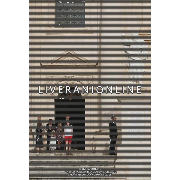 (130920) -- SYRACUSE, Sept. 20, 2013 () -- Local residents attend a wedding at the Cathedral in Ortigia, the old town of Syracuse in Sicily, Italy, Sept. 5, 2013. Located in the southeast corner of the island of Sicily, Syracuse is a historic city in Italy. The 2,700-year-old city founded in 734 or 733 BC by Greek settlers from Corinth and Tenea played a key role in ancient times when it was one of the major powers of the Mediterranean world. Once described by Cicero, renowned Roman philosopher and orator, as \'the greatest Greek city and the most beautiful of them all\', the city was listed by UNESCO as a World Heritage Site along with the Necropolis of Pantalica in 2005. (/Zhou Lei) ©PHOTOSHOT/AGENZIA ALDO LIVERANI SAS - ITALY ONLY - EDITORIAL USE ONLY