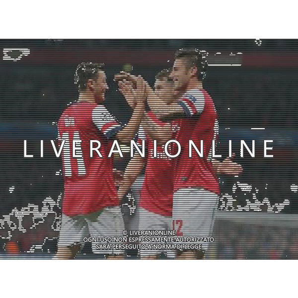 Arsenal\'s Olivier Giroud celebrates scoring his sides second goal with Arsenal\'s Mesut Ozil Photo by Kieran Galvin/CameraSport Football - UEFA Champions League Group F - Arsenal v Napoli - Tuesday 1st October 2013 - The Emirates Stadium - London Œ© CameraSport - 43 Linden Ave. Countesthorpe. Leicester. England. LE8 5PG - Tel: +44 (0) 116 277 4147 - admin@camerasport.com - www.camerasport.com AG ALDO LIVERANI SAS ONLY ITALY