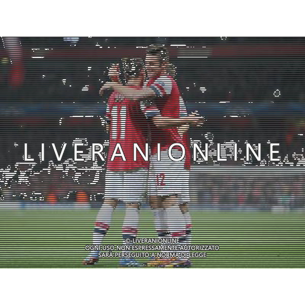 Arsenal\'s Olivier Giroud celebrates scoring his sides second goal with Arsenal\'s Mesut Ozil Photo by Kieran Galvin/CameraSport Football - UEFA Champions League Group F - Arsenal v Napoli - Tuesday 1st October 2013 - The Emirates Stadium - London Œ© CameraSport - 43 Linden Ave. Countesthorpe. Leicester. England. LE8 5PG - Tel: +44 (0) 116 277 4147 - admin@camerasport.com - www.camerasport.com AG ALDO LIVERANI SAS ONLY ITALY