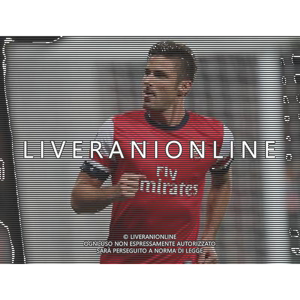 Arsenal\'s Olivier Giroud celebrates scoring his sides second goal Photo by Kieran Galvin/CameraSport Football - UEFA Champions League Group F - Arsenal v Napoli - Tuesday 1st October 2013 - The Emirates Stadium - London Œ© CameraSport - 43 Linden Ave. Countesthorpe. Leicester. England. LE8 5PG - Tel: +44 (0) 116 277 4147 - admin@camerasport.com - www.camerasport.com AG ALDO LIVERANI SAS ONLY ITALY