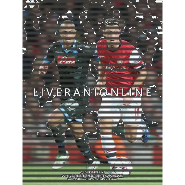 Arsenal\'s Mesut Ozil in action Photo by Kieran Galvin/CameraSport Football - UEFA Champions League Group F - Arsenal v Napoli - Tuesday 1st October 2013 - The Emirates Stadium - London Œ© CameraSport - 43 Linden Ave. Countesthorpe. Leicester. England. LE8 5PG - Tel: +44 (0) 116 277 4147 - admin@camerasport.com - www.camerasport.com AG ALDO LIVERANI SAS ONLY ITALY