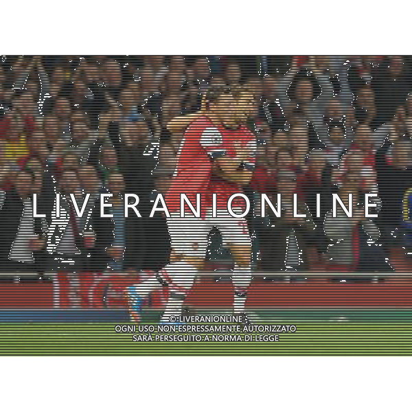  Mathieu Flamini and Mesut Ozil celebrate Arsenal\'s first goal in the Champions League match between Arsenal and Napoli. Held at the Emirates Stadium, London, on Tuesday October 01, 2013. ©photoshot/AGENZIA ALDO LIVERANI SAS - ITALY ONLY - EDITORIAL USE ONLY