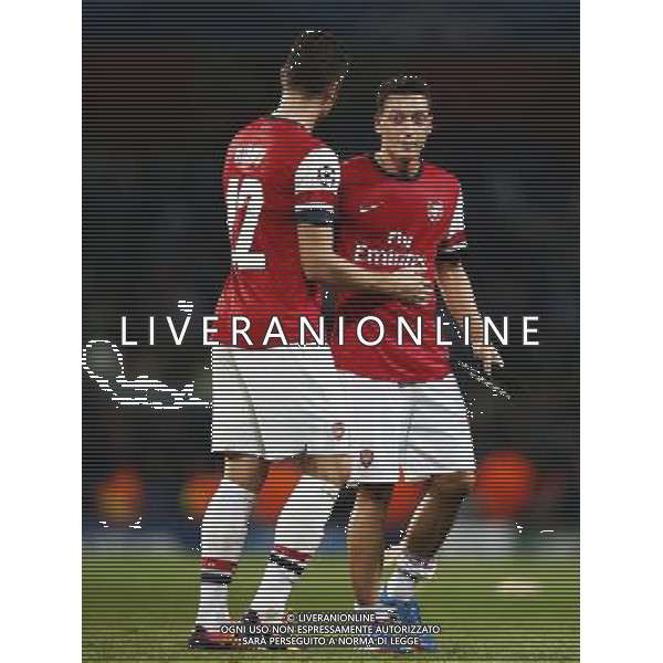 (131002) -- LONDON, Oct. 2, 2013 () -- Mesut Ozil of Arsenal celebrates victory with teammate Olivier Giroud after the UEFA Champions League Group F match between Arsenal and Napoli at Emirates Stadium in London, Britain, on Oct. 1, 2013. Arsenal won 2-0. (/Wang Lili) ©photoshot/AGENZIA ALDO LIVERANI SAS - ITALY ONLY - EDITORIAL USE ONLY