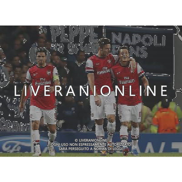 (131002) -- LONDON, Oct. 2, 2013 () -- Olivier Giroud(C) of Arsenal celebrates scoring with Mesut Ozil(R) during the UEFA Champions League Group F match between Arsenal and Napoli at Emirates Stadium in London, Britain, on Oct. 1, 2013. Arsenal won 2-0. (/Wang Lili) ©photoshot/AGENZIA ALDO LIVERANI SAS - ITALY ONLY - EDITORIAL USE ONLY
