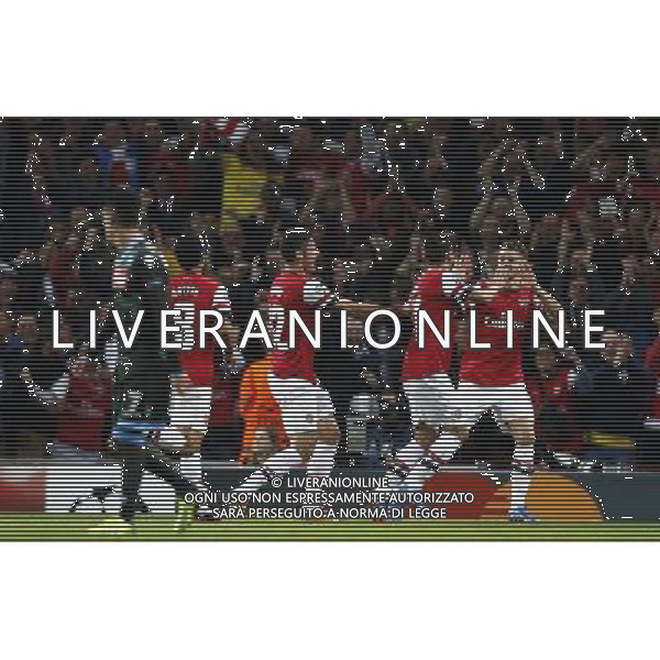 (131002) -- LONDON, Oct. 2, 2013 () -- Mesut Ozil(2nd, R) of Arsenal celebrates scoring with teammate Aaron Ramsey(1st, R) during the UEFA Champions League Group F match between Arsenal and Napoli at Emirates Stadium in London, Britain, on Oct. 1, 2013. Arsenal won 2-0. (/Wang Lili) ©photoshot/AGENZIA ALDO LIVERANI SAS - ITALY ONLY - EDITORIAL USE ONLY