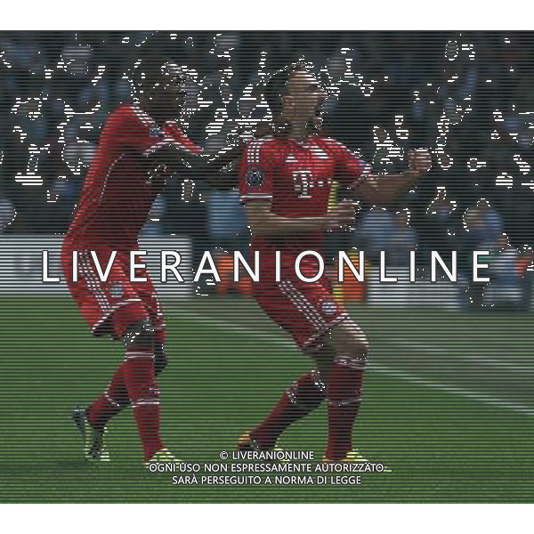 Bayern Munich\'s Franck Ribery (right) celebrates scoring the opening goal with teammate David Alaba Photo by Rich Linley/CameraSport Football - UEFA Champions League Group D - Manchester City v Bayern Munich - Wednesday 2nd October 2013 - Etihad Stadium - Manchester © CameraSport - 43 Linden Ave. Countesthorpe. Leicester. England. LE8 5PG - Tel: +44 (0) 116 277 4147 - admin@camerasport.com - www.camerasport.com AG ALDO LIVERANI SAS ONLY ITALY