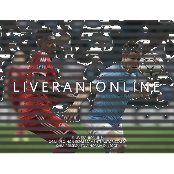 Manchester City\'s James Milner shields the ball from Bayern Munich\'s Jerome Boateng Photo by Rich Linley/CameraSport Football - UEFA Champions League Group D - Manchester City v Bayern Munich - Wednesday 2nd October 2013 - Etihad Stadium - Manchester © CameraSport - 43 Linden Ave. Countesthorpe. Leicester. England. LE8 5PG - Tel: +44 (0) 116 277 4147 - admin@camerasport.com - www.camerasport.com AG ALDO LIVERANI SAS ONLY ITALY