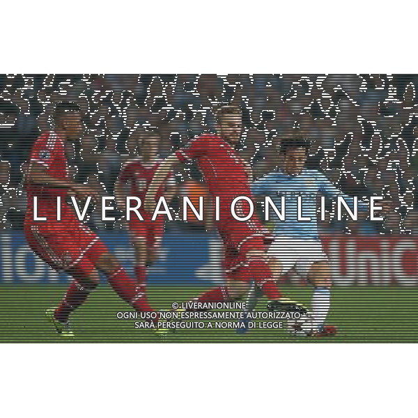 Manchester City\'s David Silva is tackled by Bayern Munich\'s Jan Kirchhoff Photo by Rich Linley/CameraSport Football - UEFA Champions League Group D - Manchester City v Bayern Munich - Wednesday 2nd October 2013 - Etihad Stadium - Manchester © CameraSport - 43 Linden Ave. Countesthorpe. Leicester. England. LE8 5PG - Tel: +44 (0) 116 277 4147 - admin@camerasport.com - www.camerasport.com AG ALDO LIVERANI SAS ONLY ITALY