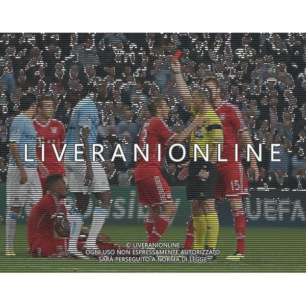 Bayern Munich\'s Jerome (sitting) is shown a red card by Referee Bjorn Kuipers after a challenge on the edge of Manchester City\'s penalty area Photo by Rich Linley/CameraSport Football - UEFA Champions League Group D - Manchester City v Bayern Munich - Wednesday 2nd October 2013 - Etihad Stadium - Manchester © CameraSport - 43 Linden Ave. Countesthorpe. Leicester. England. LE8 5PG - Tel: +44 (0) 116 277 4147 - admin@camerasport.com - www.camerasport.com AG ALDO LIVERANI SAS ONLY ITALY