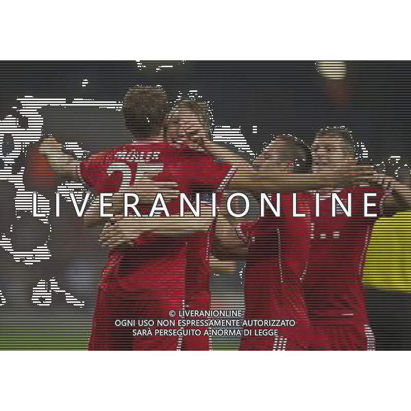 Bayern Munich\'s Thomas Muller celebrates scoring his sides second goal with team-mates Bastian Schweinsteiger and Franck Ribery Photo by Stephen White/CameraSport Football - UEFA Champions League Group D - Manchester City v Bayern Munich - Wednesday 2nd October 2013 - Etihad Stadium - Manchester å© CameraSport - 43 Linden Ave. Countesthorpe. Leicester. England. LE8 5PG - Tel: +44 (0) 116 277 4147 - admin@camerasport.com - www.camerasport.com AG ALDO LIVERANI SAS ONLY ITALY
