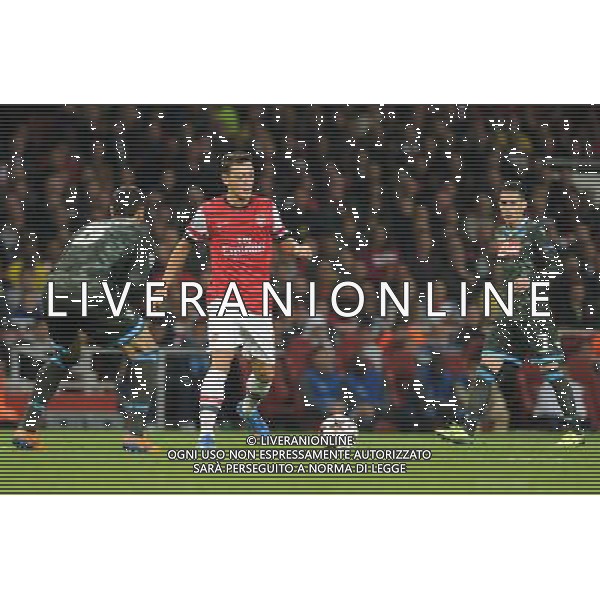  Mesut Ozil playing in the Champions League match between Arsenal and Napoli. Held at the Emirates Stadium, London, on Tuesday October 01, 2013. ©photoshot/AGENZIA ALDO LIVERANI SAS - ITALY ONLY - EDITORIAL USE ONLY