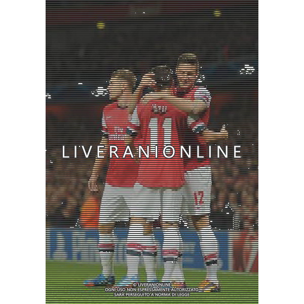  Olivier Giroud and Mesut Ozil celebrate Arsenal\'s second goal in the Champions League match between Arsenal and Napoli. Held at the Emirates Stadium, London, on Tuesday October 01, 2013. ©photoshot/AGENZIA ALDO LIVERANI SAS - ITALY ONLY - EDITORIAL USE ONLY