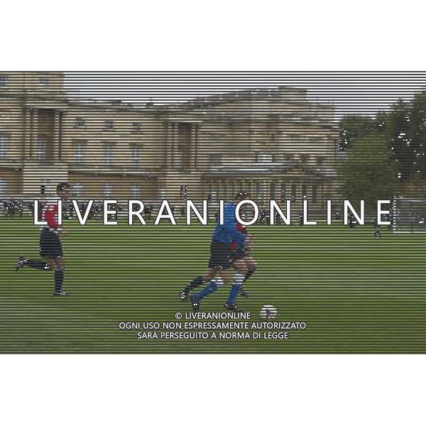 The Duke of Cambridge, as President of The Football Association, hosts a reception and football match at Buckingham Palace to celebrate The FA\'s 150 Grassroots Heroes and he also took part in a FA skills lesson. Gardens of Buckingham Palace, London. Polytechnic FC (In Blue) play Civil Service FC in a Southern Amateur League football match in the grounds of Buckingham Palace, in central London, on October 7, 2013. Britain\'s Prince William warned footballers to watch the Buckingham Palace windows as Queen Elizabeth II\'s official residence staged the first football match in its 308-year history. ©photoshot/AGENZIA ALDO LIVERANI SAS - ITALY ONLY - REALI INGLESI: Partita di calcio amichevole a Buchingham Palace. Il principe William presidente onorario della Football Association e ha festeggiato i 150 anni con tanti ospiti illustri ed ex calciatori.