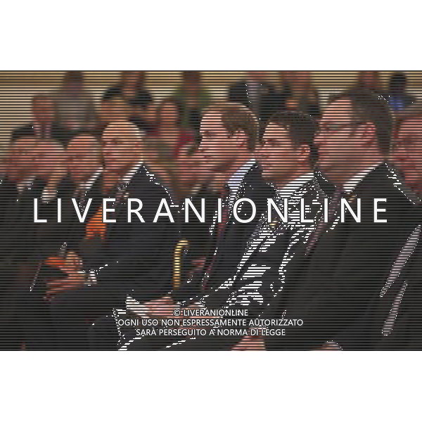 LONDON, ENGLAND - OCTOBER 07: Prince William, Duke of Cambridge (C), in his role as President of The Football Association, sits with former England footballer Michael Owen (2nd R) in the Ballroom of Buckingham Palace at an event to honour The FA\'s 150 Grassroots Heroes on October 7, 2013 in London, England. 150 volunteers who work to support grassroots football. were presented with a medal by The Duke of Cambridge and Greg Dyke, the Charmian of the Football Association. To celebrate 150 years of the FA, an official Southern Amateur League fixture football match will take place in the grounds of Buckingham Palace between two of the oldest amateur clubs in England. The match will be played between Civil Service FC, the sole surviving club from the eleven that met to create The FA in 1863, and Polytechnic FC, which was formed in 1875. ©PHOTOSHOT/AGENZIA ALDO LIVERANI SAS - ITALY ONLY - EDITORIAL USE ONLY