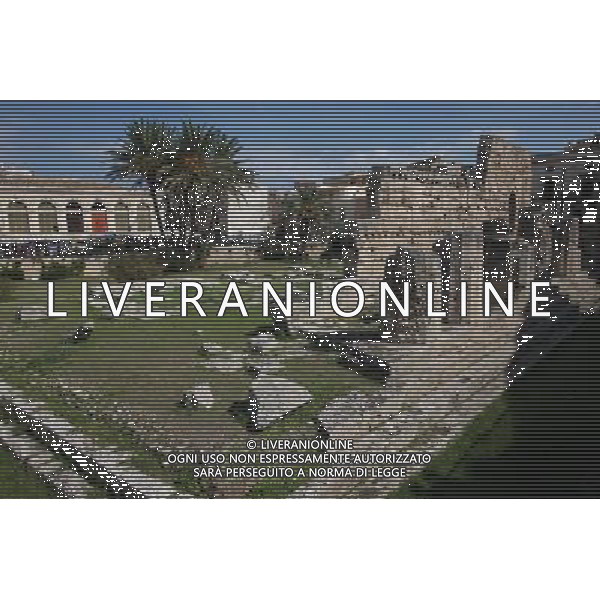 (131008) -- SYRACUSE, Oct. 8, 2013 () -- Photo taken on Oct. 7, 2013 shows a view of the Temple of Apollo in Syracuse of Italy. Ancient Syracuse includes the nucleus of the city\'s foundation as Ortygia by Greeks from Corinth in the 8th century BC. The site of the city, which Cicero described as \'the greatest Greek city and the most beautiful of all\', retains vestiges such as the Temple of Athena (5th century BC, later transformed to serve as a cathedral), a Greek theatre, a Roman amphitheatre, a fort and more. Many remains bear witness to the troubled history of Sicily, from the Byzantines to the Bourbons, interspersed with the Arab-Muslims, the Normans, Frederick II of the Hohenstaufen dynasty (1197--1250), the Aragons and the Kingdom of the Two Sicilies. Historic Syracuse offers a unique testimony to the development of Mediterranean civilization over three millennia. The UNESCO Commitee inscribed Syracuse as a world heritage site in 2005. (/Du Juanjuan) ©photoshot/AGENZIA ALDO LIVERANI SAS - ITALY ONLY - Il Centro storico della citta\' di Siracusa offre una testimonianza unica per lo sviluppo della civilta\' mediterranea oltre tre millenni inscritta dal Comitato UNESCO come sito del patrimonio mondiale nel 2005.