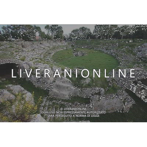 (131008) -- SYRACUSE, Oct. 8, 2013 () -- Photo taken on Oct. 7, 2013 shows a view of the Roman amphitheatre in Syracuse, Italy. Ancient Syracuse includes the nucleus of the city\'s foundation as Ortygia by Greeks from Corinth in the 8th century BC. The site of the city, which Cicero described as \'the greatest Greek city and the most beautiful of all\', retains vestiges such as the Temple of Athena (5th century BC, later transformed to serve as a cathedral), a Greek theatre, a Roman amphitheatre, a fort and more. Many remains bear witness to the troubled history of Sicily, from the Byzantines to the Bourbons, interspersed with the Arab-Muslims, the Normans, Frederick II of the Hohenstaufen dynasty (1197--1250), the Aragons and the Kingdom of the Two Sicilies. Historic Syracuse offers a unique testimony to the development of Mediterranean civilization over three millennia. The UNESCO Commitee inscribed Syracuse as a world heritage site in 2005. (/Du Juanjuan) ©photoshot/AGENZIA ALDO LIVERANI SAS - ITALY ONLY - Il Centro storico della citta\' di Siracusa offre una testimonianza unica per lo sviluppo della civilta\' mediterranea oltre tre millenni inscritta dal Comitato UNESCO come sito del patrimonio mondiale nel 2005.