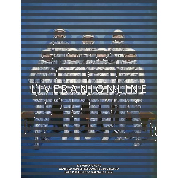 Space Original 7 astronauts in Mercury space suits. Front row, left to right, are Walter M. Schirra Jr., Donald K. Slayton, John H. Glenn Jr., and M. Scott Carpenter. Back row, from the left, are Alan B. Sh