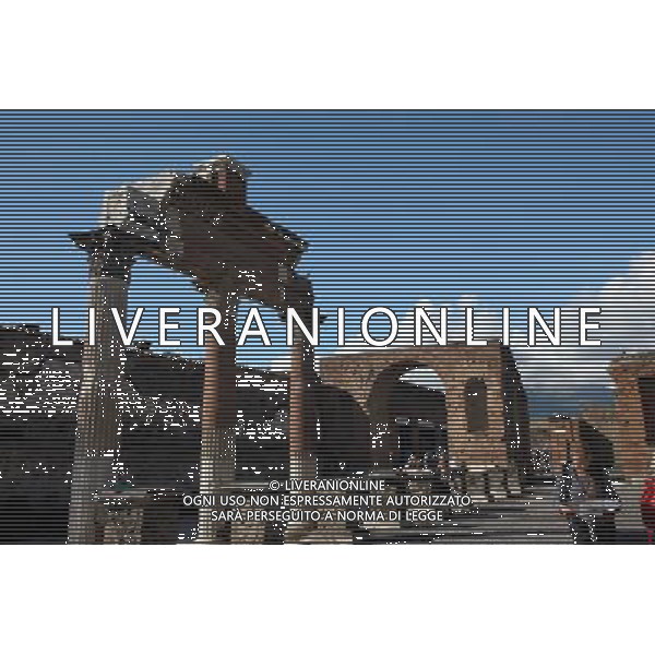 (131012) -- BEIJING, Oct. 12, 2013 () -- Photo taken on Oct. 9, 2013 shows a view of the Roman pillars of Sanctuary of Lari Pubblici in Pompei, Italy. When Vesuvius erupted on Aug. 24, AD 79, it engulfed the flourishing Roman towns of Pompei. These have been progressively excavated and made accessible to the public since the mid-18th century, reappearing the vast expanse of the commercial town of Pompei. The UNESCO Commitee inscribed Archaeological Areas of Pompei, Herculaneum and Torre Annunziata as a world heritage site in 1997. (/Du Juanjuan) ©Photoshot/Ag. Aldo Liverani s.a.s.-Only Italy-Editorial Use Only