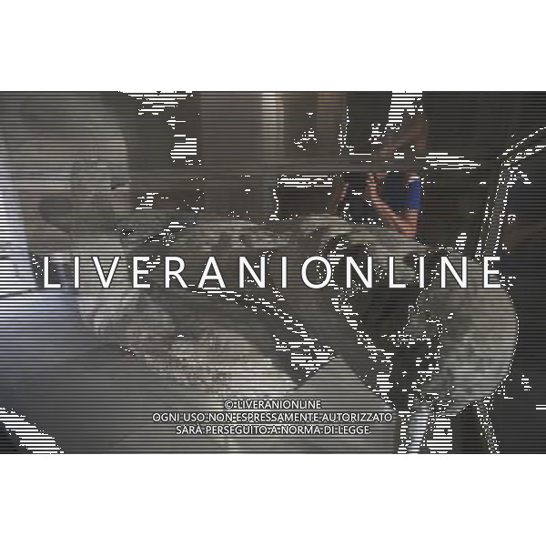 (131012) -- BEIJING, Oct. 12, 2013 () -- A tourist takes photos of the body of a victim in Pompei, Italy, on Oct. 9, 2013. When Vesuvius erupted on Aug. 24, AD 79, it engulfed the flourishing Roman towns of Pompei. These have been progressively excavated and made accessible to the public since the mid-18th century, reappearing the vast expanse of the commercial town of Pompei. The UNESCO Commitee inscribed Archaeological Areas of Pompei, Herculaneum and Torre Annunziata as a world heritage site in 1997. (/Du Juanjuan) ©Photoshot/Ag. Aldo Liverani s.a.s.-Only Italy-Editorial Use Only