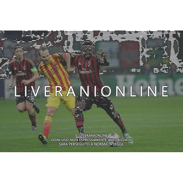 UEFA Champions League - Fase a gironi 3Â° giornata gruppo H Milano 22-10-2013 Stadio Giuseppe Meazza San Siro Milan - Barcellona nella foto Iniesta e Muntari foto Roberto Garavaglia - ag. Aldo Liverani
