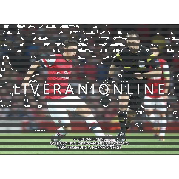 Arsenal\'s Mesut Ozil in action Photo by Kieran Galvin/CameraSport Football - UEFA Champions League Group F - Arsenal v Borussia Dortmund - Tuesday 22nd October 2013 - emirates stadium - London å© CameraSport - 43 Linden Ave. Countesthorpe. Leicester. England. LE8 5PG - Tel: +44 (0) 116 277 4147 - admin@camerasport.com - www.camerasport.com /AGENZIA ALDO LIVERANI SAS - ITALY ONLY - EDITORIAL USE ONLY